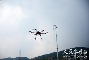 国网娄底供电公司利用无人机放线施工