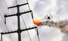 高压线上有异物 无人机喷火清除