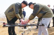 植保无人机“首飞”苹果园 省药40%，提高作业效率50倍