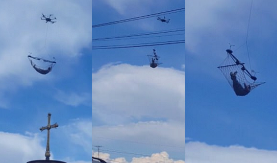 格鲁吉亚空中惊现一男子躺在无人机悬挂吊床里