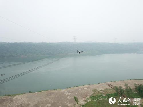 湖南：无人跨江巡视助力特高压祁韶线迎峰度夏安全无忧