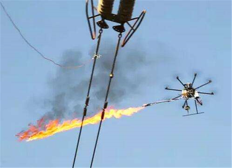 15分钟解决！国网兴安供电公司首用喷火无人机清除导线异物